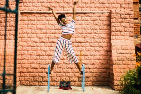 Woman in White-red-and-blue Striped Pants and Top