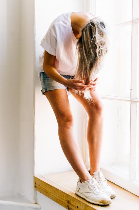 Woman in White T-shirt and Blue Denim Shot Shorts