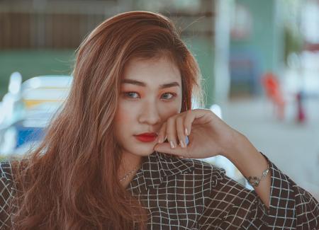 Woman Leaning Face on Hand Selective Focus Photography