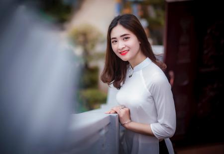 Woman Leaning on Railing