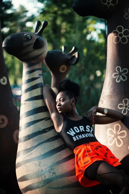 Woman Leaning on Zebra Statue