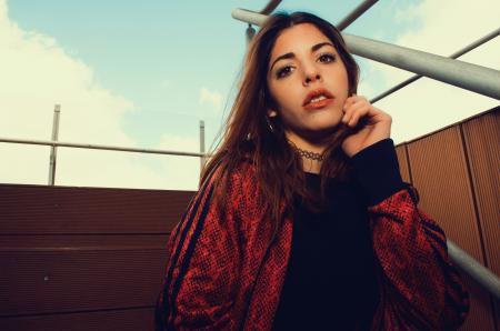 Woman Near Gray Metal Grille