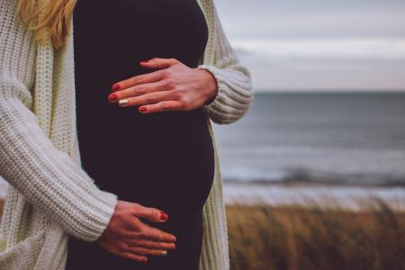 Woman Pregnant Standing Near Beach