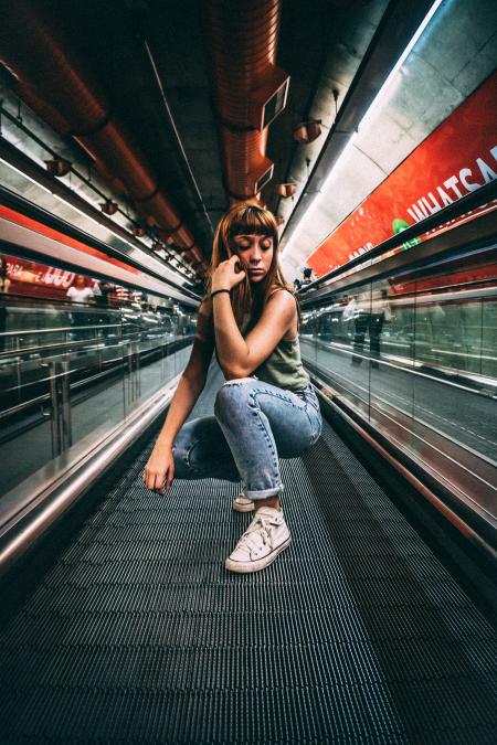 Woman Sitting in a Building