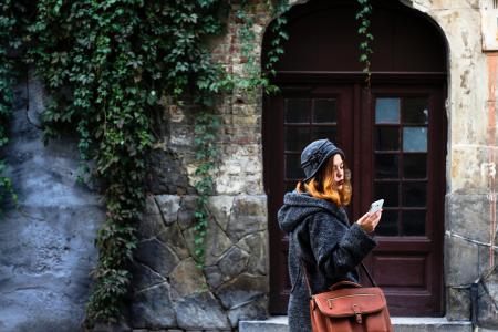 Woman Sitting in Front of Building