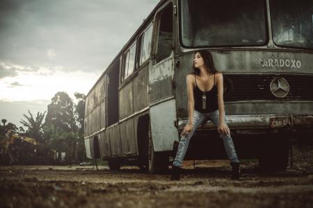 Woman Sitting in Front of Bus