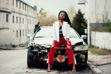 Woman Sitting in Front of the Car