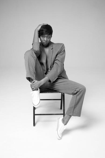 Woman Sitting On Metal Chair