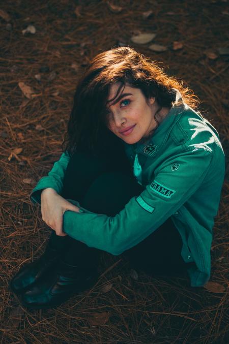 Woman Sitting on the Ground