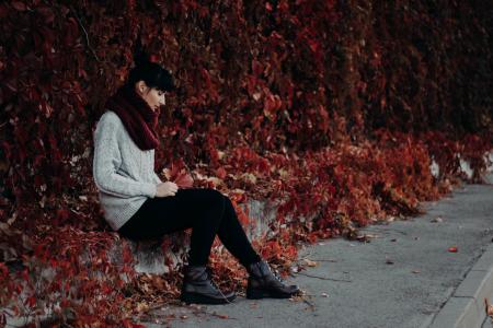 Woman Sitting on the Pavement