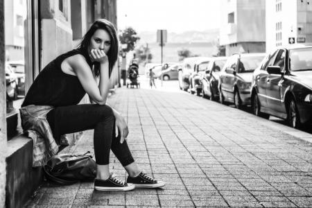 Woman Sitting on the Stairs While Taking Photo