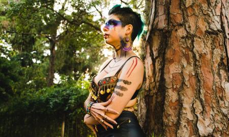 Woman Standing Beside Tree Trunk