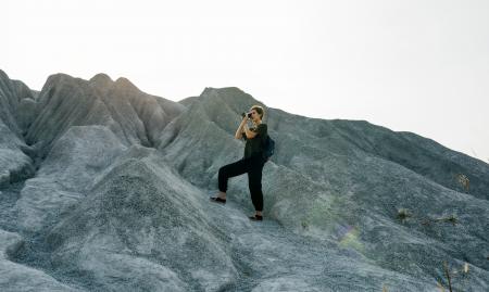 Woman Standing In Front of Mountain
