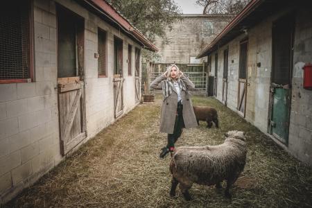 Woman Standing Near Sheep