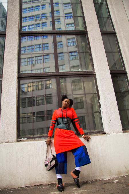 Woman Standing Next to Building