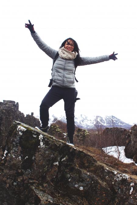 Woman Standing on a Rock Wearing Bubble Jacket