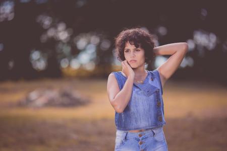 Woman Standing on Field Selective Focus Photography