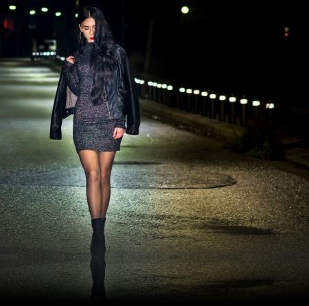 Woman Standing on the Center of the Road