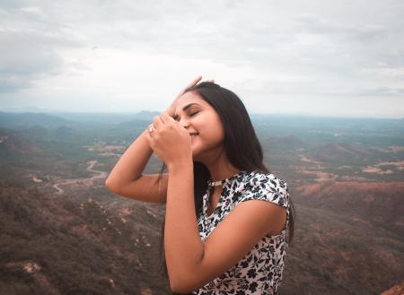 Woman Standing Peak of Mountain
