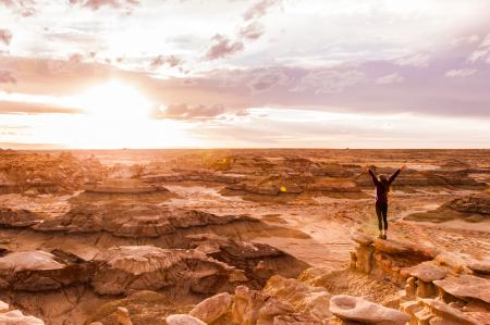 Woman Stands on Brown Surface at Daytime