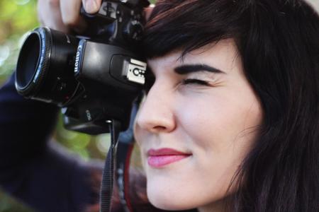 Woman Taking a Photo With Canon Dslr Camera