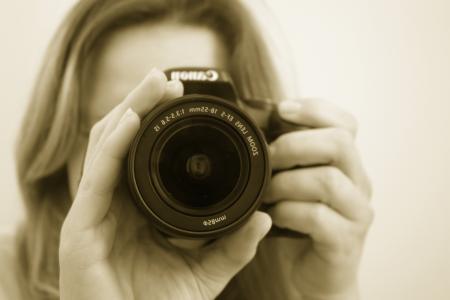 Woman Taking a Picture Using Canon Dslr