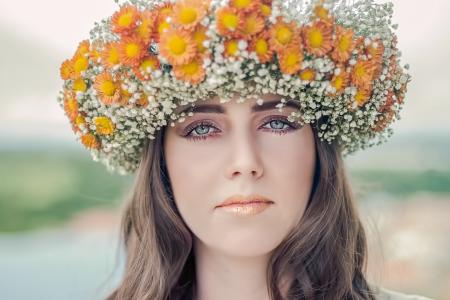 Woman Using White and Orange Floral Hat