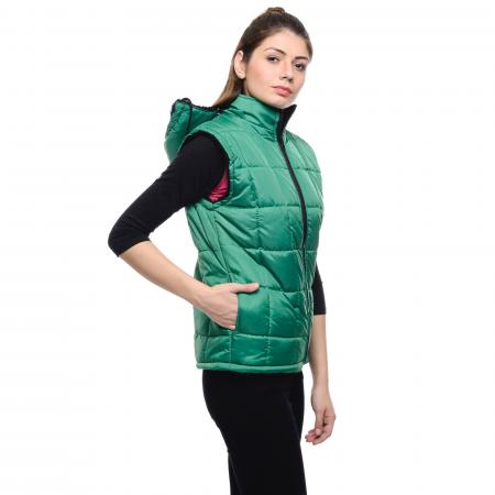 Woman Wearing a Green Puffer Vest and a Black Pants