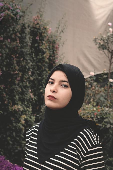 Woman Wearing Black and White Striped Top and Black Veil