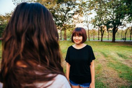 Woman Wearing Black Boat-neck Shirt on Green Grass