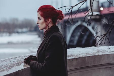 Woman Wearing Black Coat Standing In-front of Balcony