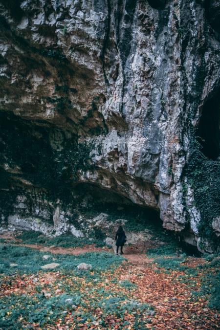 Woman Wearing Black Coat Standing Near Gray Mountain