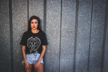 Woman Wearing Black Crew Neck Shirt and Blue Denim Shorts