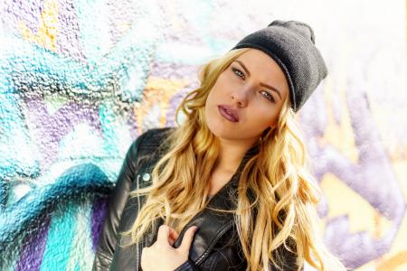 Woman Wearing Black Leather Jacket and Black Knit Cap