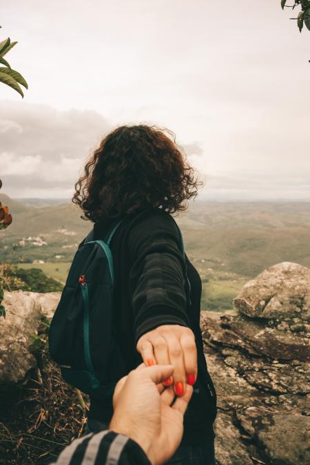 Woman Wearing Black Long-sleeved Shirt Holding Someone's Hand