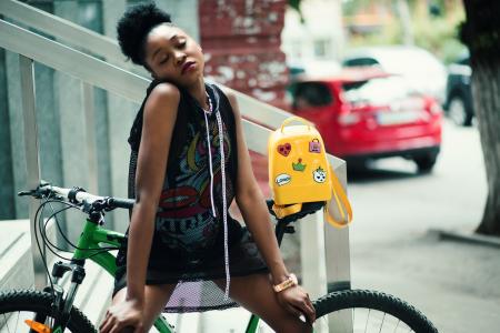 Woman Wearing Black Sleeveless Top With Green Hardtail Bicycle at the Back