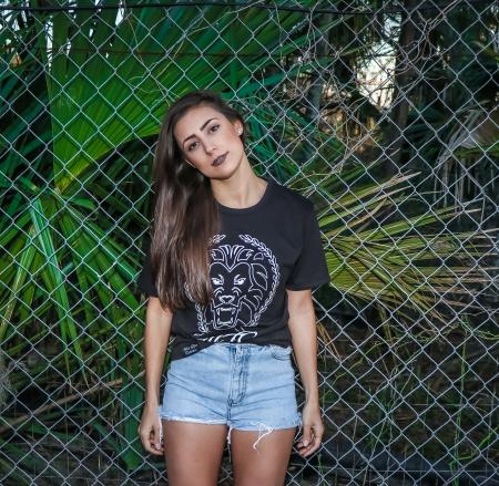 Woman Wearing Black T-shirt and Blue Denim Shorts