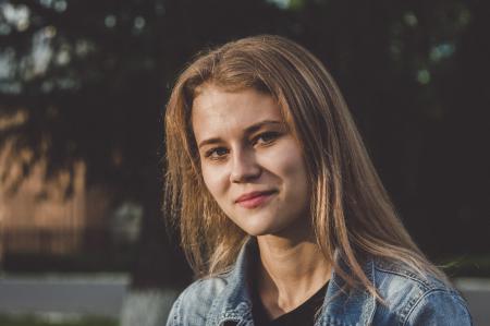 Woman Wearing Blue Denim Jacket