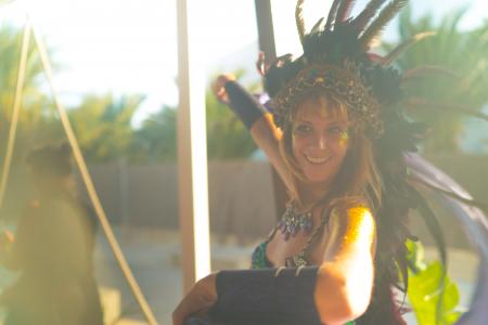 Woman Wearing Blue Spaghetti-strap Top With Feather Headdress