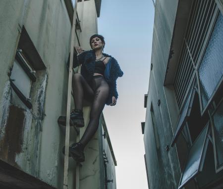 Woman Wearing Brassiere and Panty Climbing on the Ladder Photo