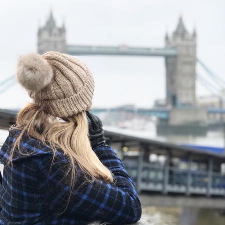 Woman Wearing Brown Beanie Holding Smartphone