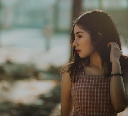Woman Wearing Brown Sleeveless Dress