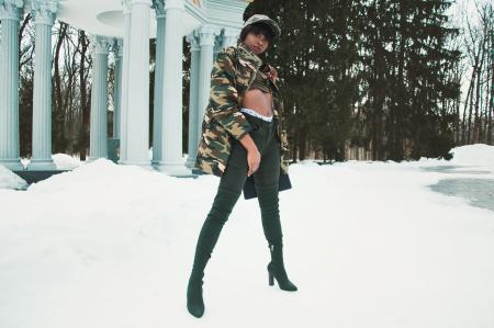 Woman Wearing Camouflage Jacket Standing on Snow