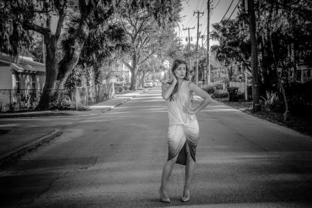 Woman Wearing Dress Standing on Center of Road