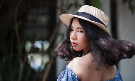 Woman Wearing Fedora Hat and Off-shoulder Top