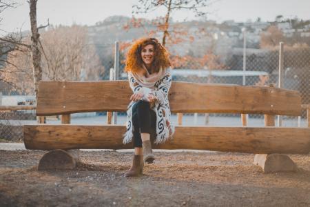 Woman Wearing Floral Cardigan Sit on Bench