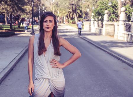 Woman Wearing Gray Sleeveless Slit Dress