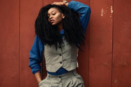 Woman Wearing Gray Waist Coat and Blue Long-sleeved Shirt