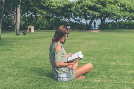 Woman Wearing Green Top Reading Book