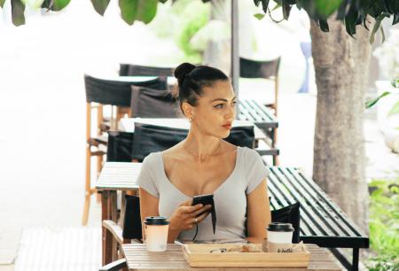 Woman Wearing Grey Shirt Sitting on Chair